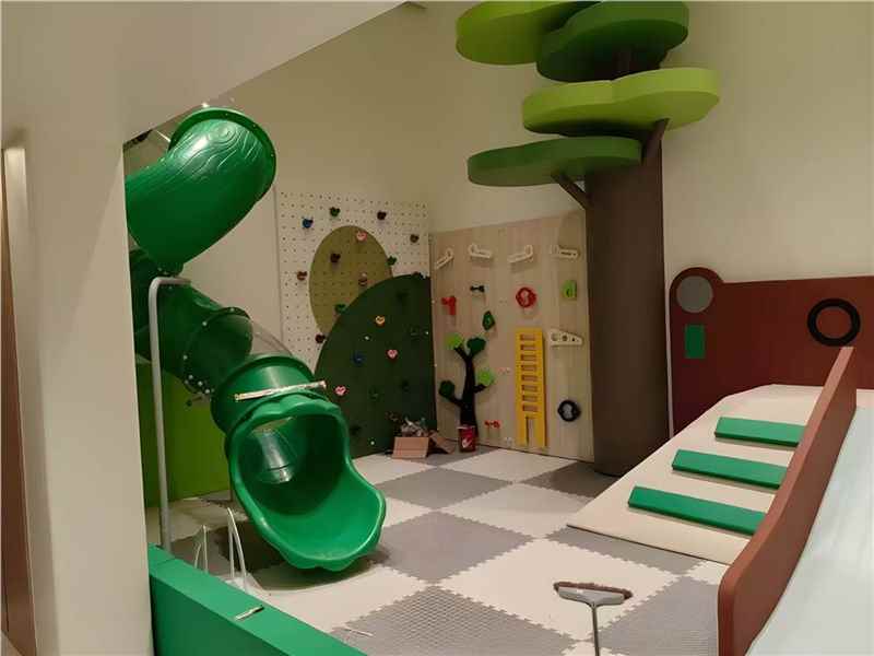 Toddler soft play corner with tree theme slide